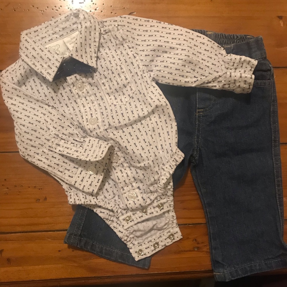 Button up onesie with bow tie and jeans.